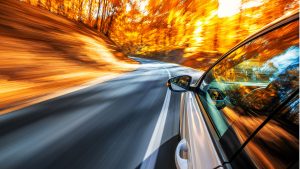 Car driving on a curvy road.